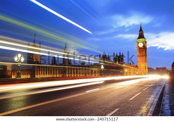 Big Ben and London at night with the lights of
the cars passing by after rain, the most prominent symbols of both
London and England