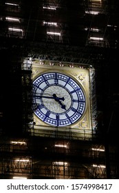 Big Ben in London, in scaffolding, during repairs, on a dark night