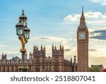 Big Ben tower and street lamp on Westminster bridge at sunset, London, UK