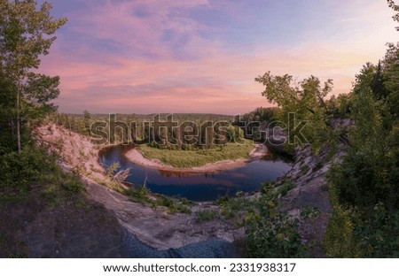 Big Bend Lookout in Arrowhead Provincial Park near Huntsville, Ontario is seen during a beautiful magenta sunset.
