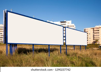 Big billboard. Advertising on the street. Billboard near the road. Place for text. Information table. Mock up. - Shutterstock ID 1290237742