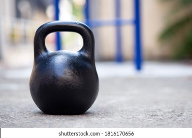 Big Black Kettlebell Outside. Kettlebell For Sports.