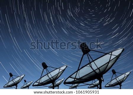 Big black Satellite Dish on star trail sky background