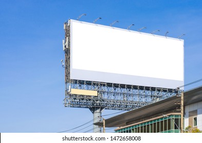 Big Blank Billboard Fabric White Screen Side Road On Building In City Side Road. Blank Ad Mockup Copy Space For Advertising Banner Near Bus Stop In Metropolis.