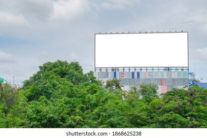 Big Blank Billboard Fabric White Screen Side Road On Building In City Side Road. Blank Ad Mockup Copy Space For Advertising Banner Near Bus Stop In Metropolis.