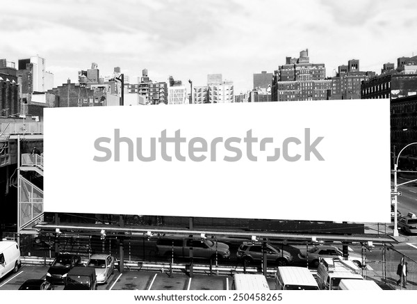 Big blank billboard sign in New York City,\
surrounded by highrise buildings. Black and white image ready for\
custom copy.