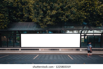 big blank billboard white LED screen horizontal outstanding in the city on pathway walking at side the road traffic with people for display advertisement text template promotion new brand at outdoor.