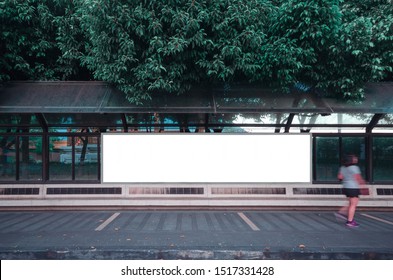 Big Blank Billboard White LED Screen Horizontal Outstanding In The City On Pathway Walking At Side The Road Traffic With People For Display Advertisement Text Template Promotion New Brand At Outdoor.