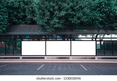 Big Blank Billboard White LED Screen Horizontal Outstanding In The City On Pathway Walking At Side The Road Traffic With People For Display Advertisement Text Template Promotion New Brand At Outdoor.