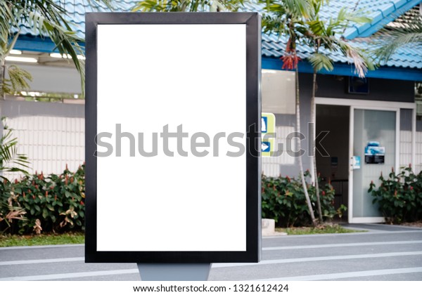 big blank\
billboard white LED screen vertical outstanding in the city on\
pathway side the road traffic with car for display advertisement\
text template promotion new brand at outdoor.\
