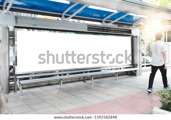 big blank\
billboard white LED screen vertical outstanding in the city on\
pathway side the road traffic with car for display advertisement\
text template promotion new brand at\
outdoor.