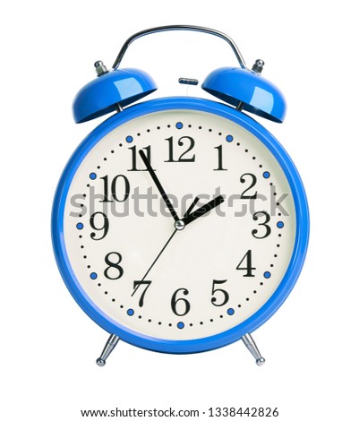 Big blue alarm clock on white background
