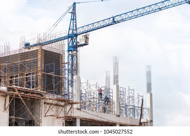 Big Blue Crane In Building Construction Site On Blue Sky Background