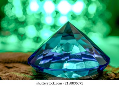 Big Blue Gem On Green Blured Background