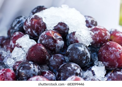 Big blue plums with the ice