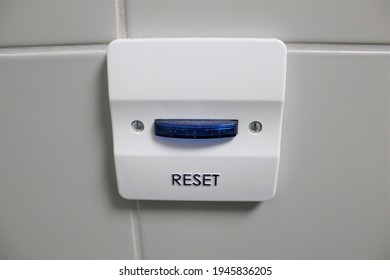 Big Blue RESET Button On A Wall