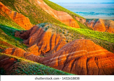 Big Bogdo Mountain. Red Sandstone Outcrops On The Slopes Sacred Mountain In Caspian Steppe Bogdo - Baskunchak Nature Reserve, Astrakhan Region, Russia.