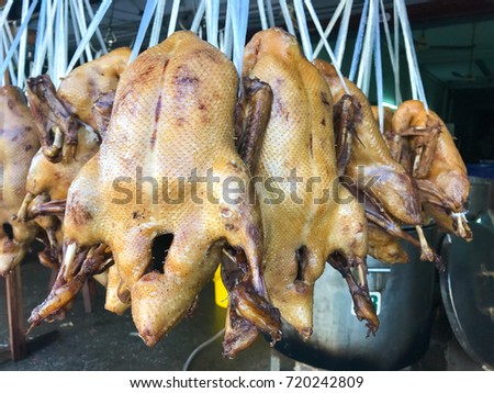 A lot of big boiled chicken and duck hanging in the fresh market, concept food of popular in Chinese new year)