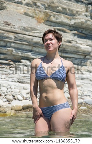 Big Booty Girls In A Striped Swimsuit A Girl With A Sports Figure Swims In Big Booty Girls In A Striped Swimsuit A Girl With A Sports Figure Swims In