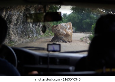 Big Boulder In The Middle Of Road Blocking Passage