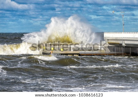 big braking waves during a gale in Kolobrzeg on the coast of the Baltic sea in Poland