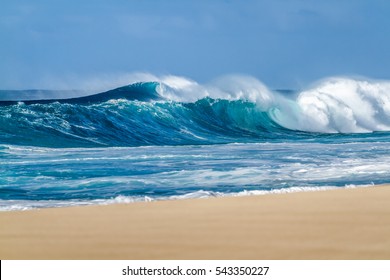 Big breaking Ocean wave on a sandy beach on the north shore of Oahu Hawaii - Shutterstock ID 543350227