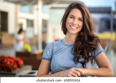 Big bright white smile headshot with a beautiful brunette woman sincere happy cheerful positive expression - Shutterstock ID 658592416