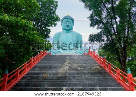 Big bronze Buddha statue. At Wat Phra That Doi Phra Chan, Mae Tha District, Lampang, Thailand.