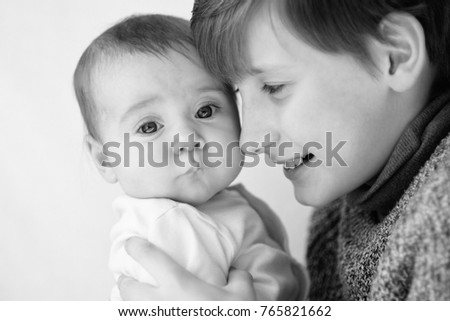 Similar – Image, Stock Photo Beautiful woman and her cute little daughter are hugging