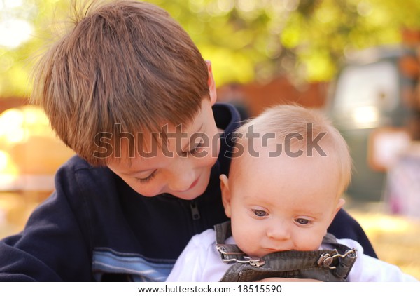 Big Brother Holding His Baby Brother Stock Photo 18515590 Shutterstock