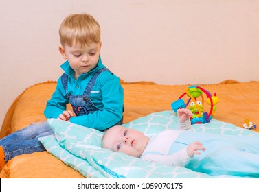 big brother is watching his younger brother with jealousy - Powered by Shutterstock