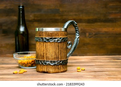 Big Brown Mug Of Beer,ale Bottle And Crispy Snacks, Pretzels, Corn, Nuts In Bowl On Wooden Table, Background Close Up. Alcohol Cocktail, Bar Drink, Booze Party Concept.mockup, Template, Copy Space.