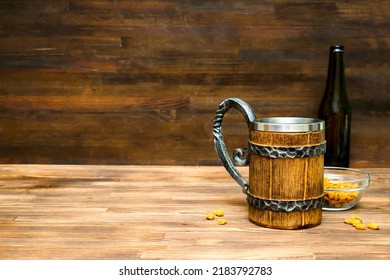 Big Brown Mug Of Beer,ale Bottle And Crispy Snacks, Pretzels, Corn, Nuts In Bowl On Wooden Table, Background Close Up. Alcohol Cocktail, Bar Drink, Booze Party Concept.mockup, Template, Copy Space.