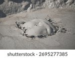 Big bubble in mud Volcano in Berca Mud Volcanoes in Romania