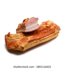 Big Bulk Piece Of Tasty Smoked Bacon. Traditional Sausage Products Over White Background. Sliced Rustic Smoked Meat.