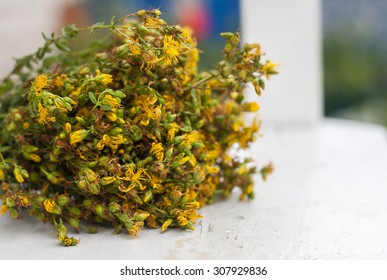 big bunch  yellow flowers Hypericum on white background. Selective focus