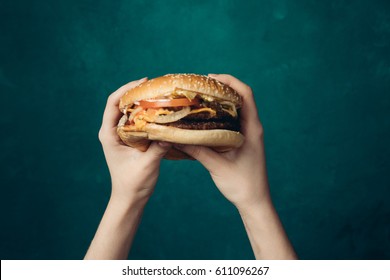 Big burger in the hands