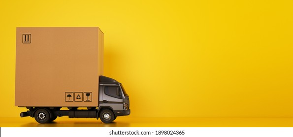 Big cardboard box package on a grey truck ready to be delivered on yellow background - Shutterstock ID 1898024365
