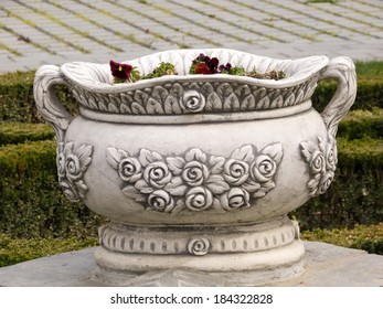 Big ceramic pot for flowers in the park with natural background