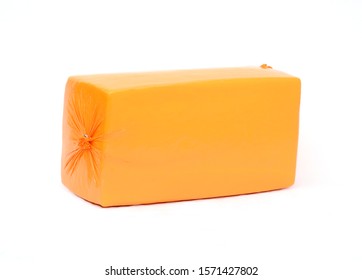 Big cheese head in yellow vacuum package. Cheese block isolated on white background