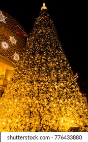 Big Christmas Tree Decorated With Reflective Material Located In Front Of Shopping Mall Welcome To Christmas And New Year Coming Soon. Not Focus To Any Object