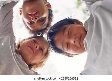 Big circle support and hug. Meeting of tree interracial Caucasian African American Asian friends. Generation z teenagers hugging Spending quality time outdoor Summer time Bottom view Underside view - Shutterstock ID 2239256511