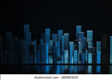 Big city sky scrapers reflecting in the water, imitation made of batch staples composition in red light on reflecting surface and black background - Powered by Shutterstock