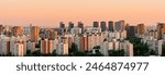 A big city at sunset, a panorama of multi-storey residential buildings. Moscow, Zapadnoye Degunino. High quality photo