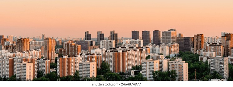 A big city at sunset, a panorama of multi-storey residential buildings. Moscow, Zapadnoye Degunino. High quality photo - Powered by Shutterstock