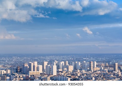big city under high blue sky with white clouds