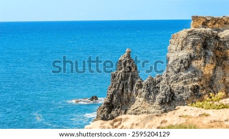The big cliffs and rocks in Cabo Rojo Puerto Rico with the Caribbean Sea in the sunny background