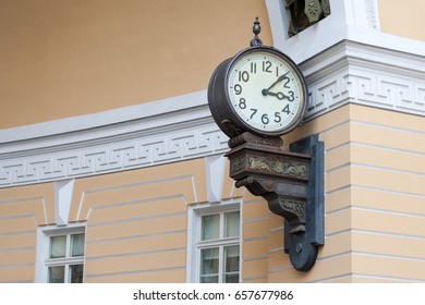 The big clock on the wall in the arch. Copy space. Photo.