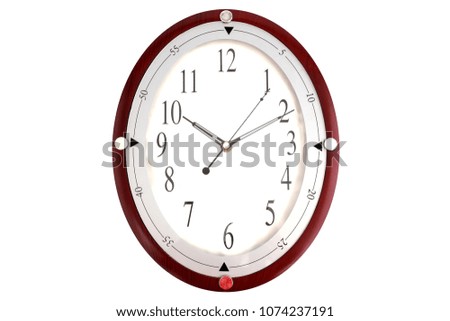 Big clock with white backdrop.