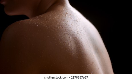 Big close-up shot of good-looking young slim white-skinned woman's wet bare shoulders on black background  Wet skin texture shot for flawless skin concept - Shutterstock ID 2179837687